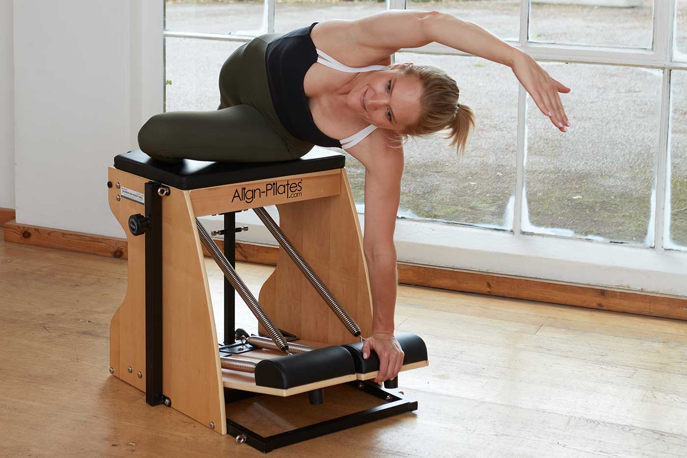 Side stretch on Align-Pilates combo chair