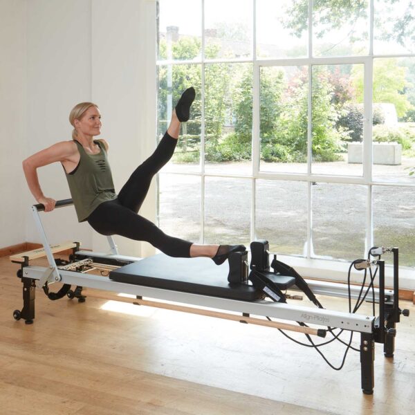 working out on commercial Pilates machine