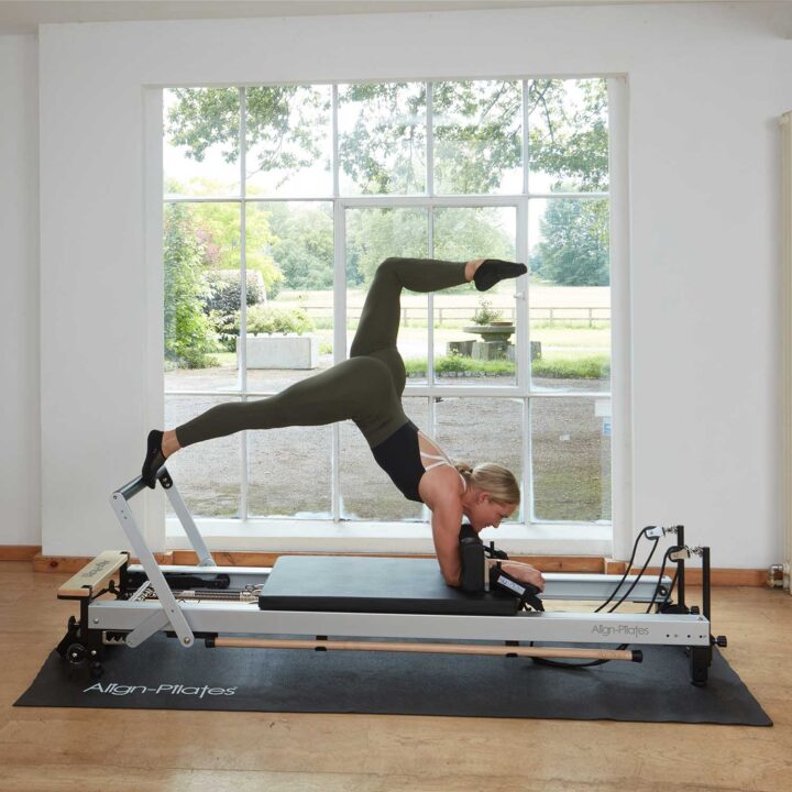 Pilates instructor works out on C8-Pro reformer