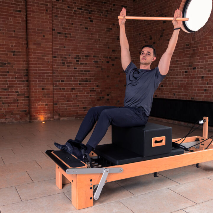 Align-Pilates Maple Roll-Up Pilates Pole on Pilates Reformer