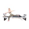 Jess on A8-Pro Pilates reformer using plank handles