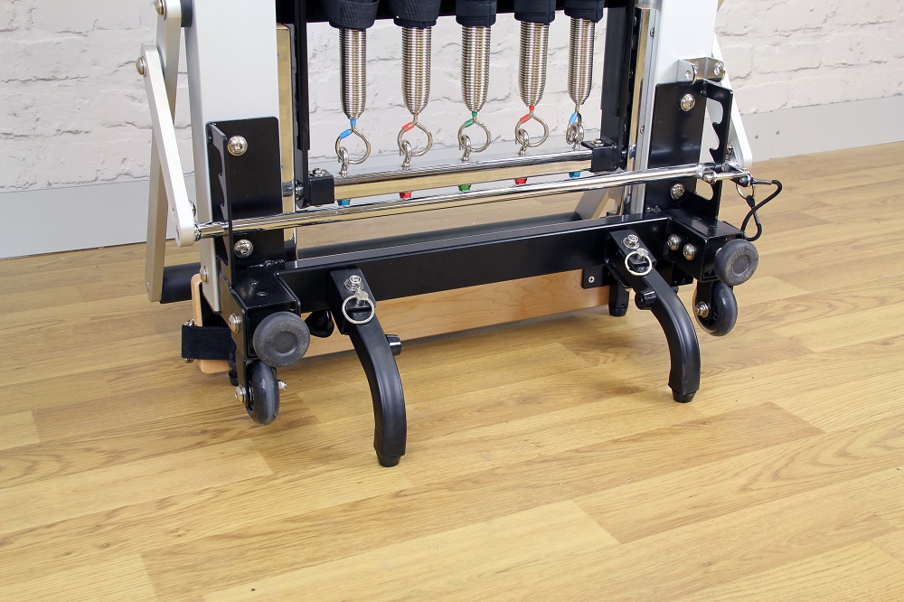 Close up of free standing legs attached to standing reformer